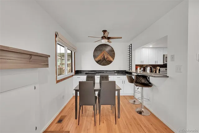a view of dining room and wooden floor