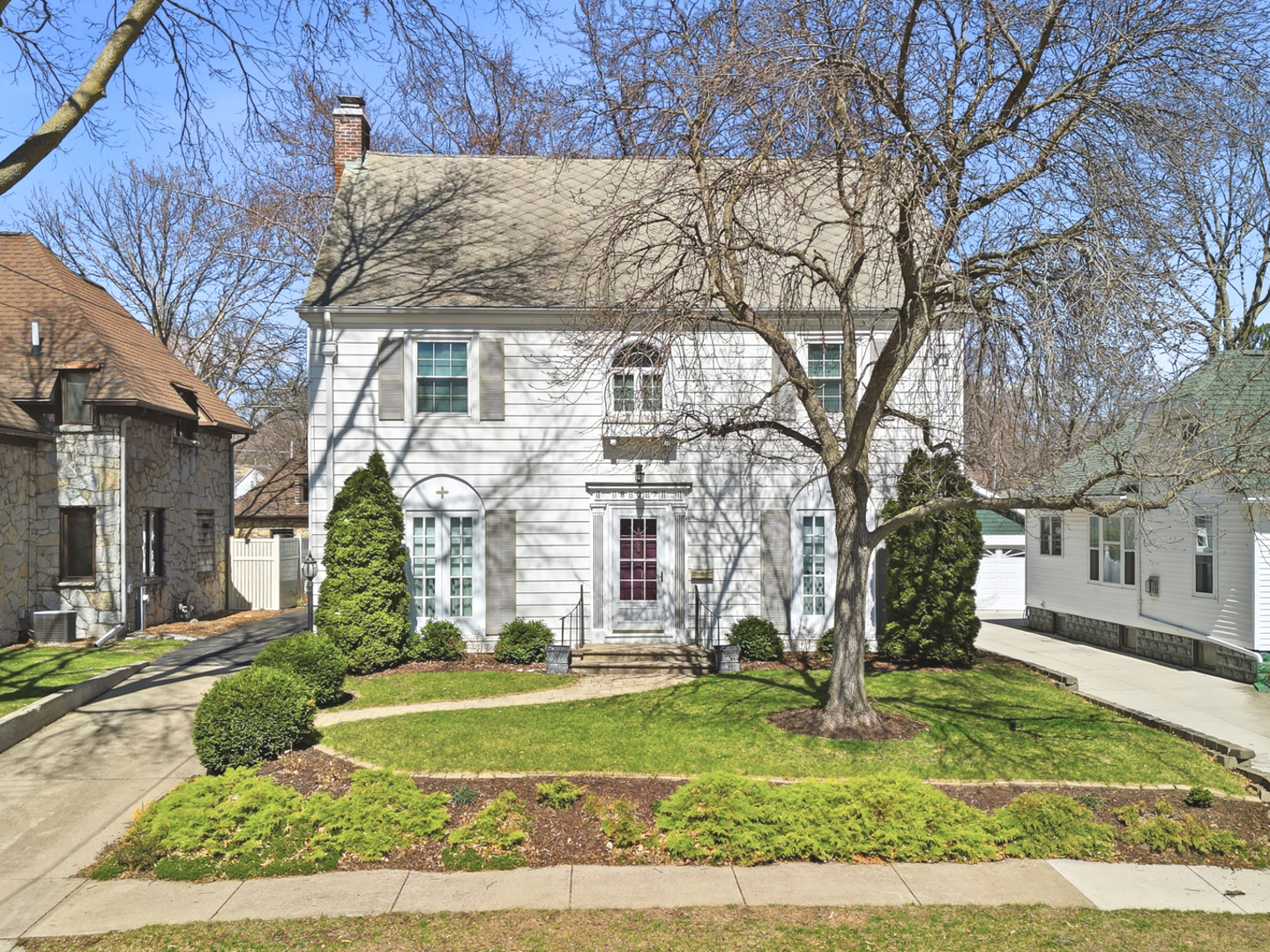 front view of a house with a yard