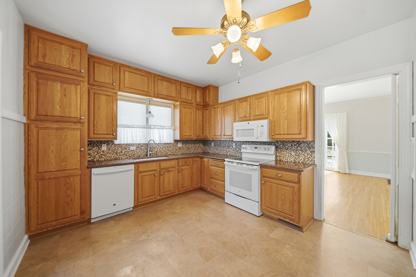 807 East Fellows Street Dixon, IL 61021 - Photo 11 of 31 a kitchen with stainless steel appliances granite countertop a stove a sink dishwasher and a refrigerator