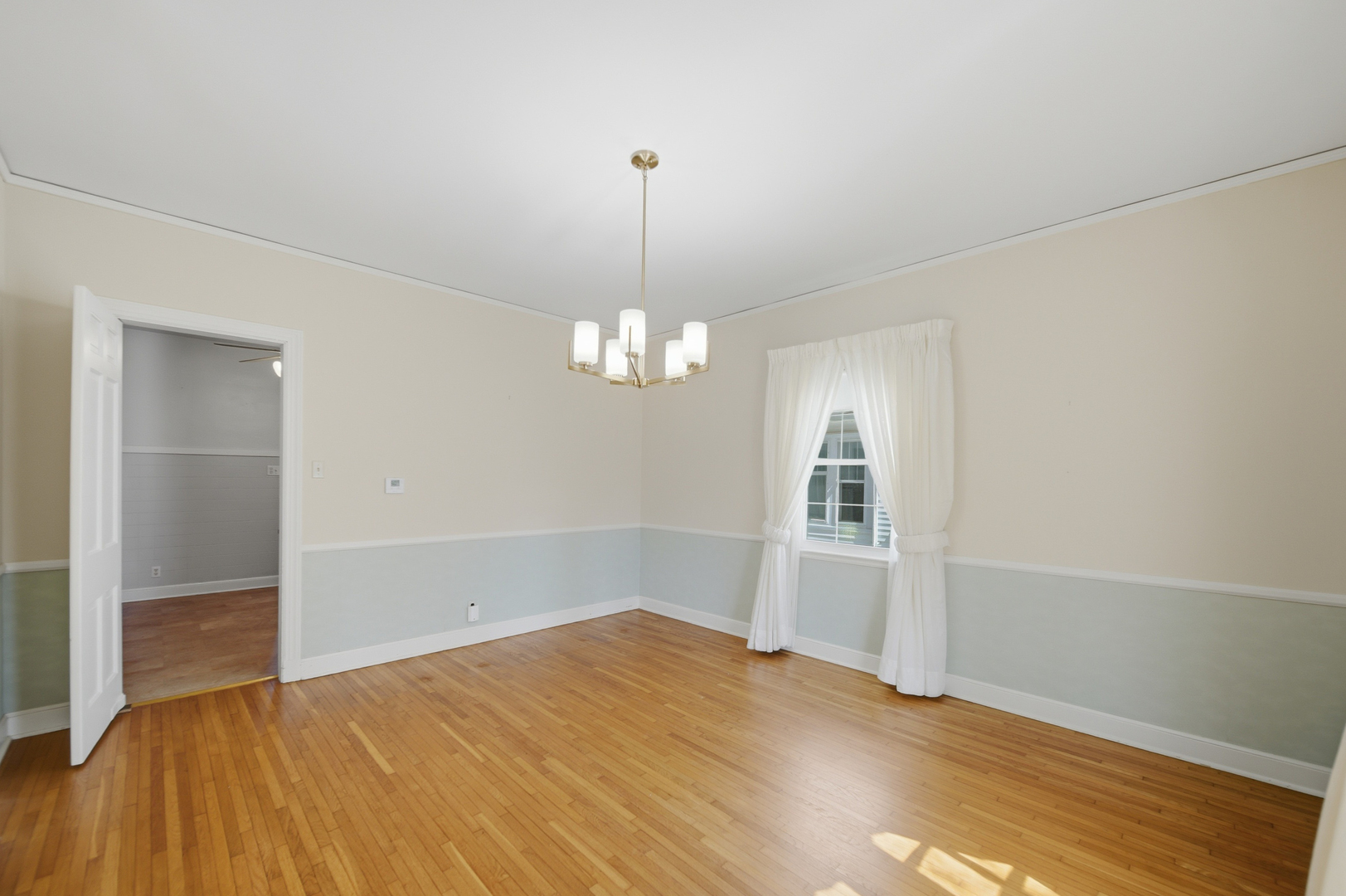 807 East Fellows Street Dixon, IL 61021 - Photo 18 of 31 wooden floor in an empty room with a window