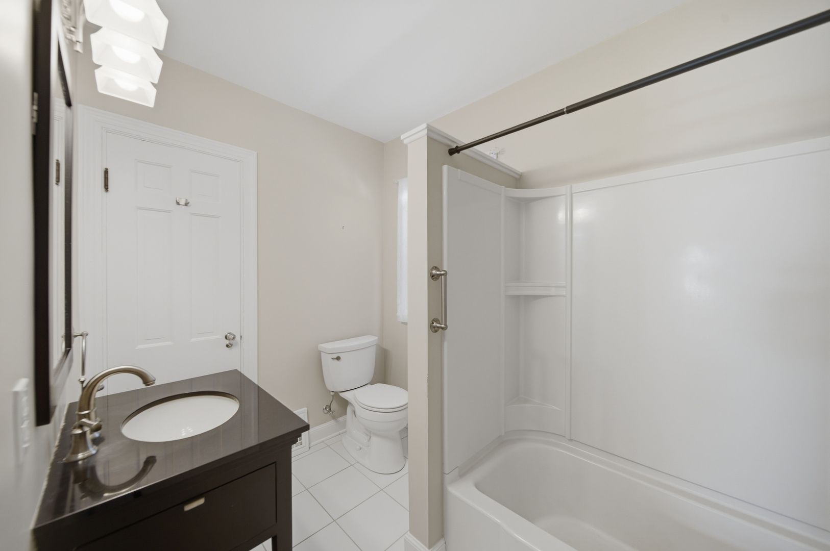807 East Fellows Street Dixon, IL 61021 - Photo 23 of 31 a bathroom with a granite countertop sink toilet and shower