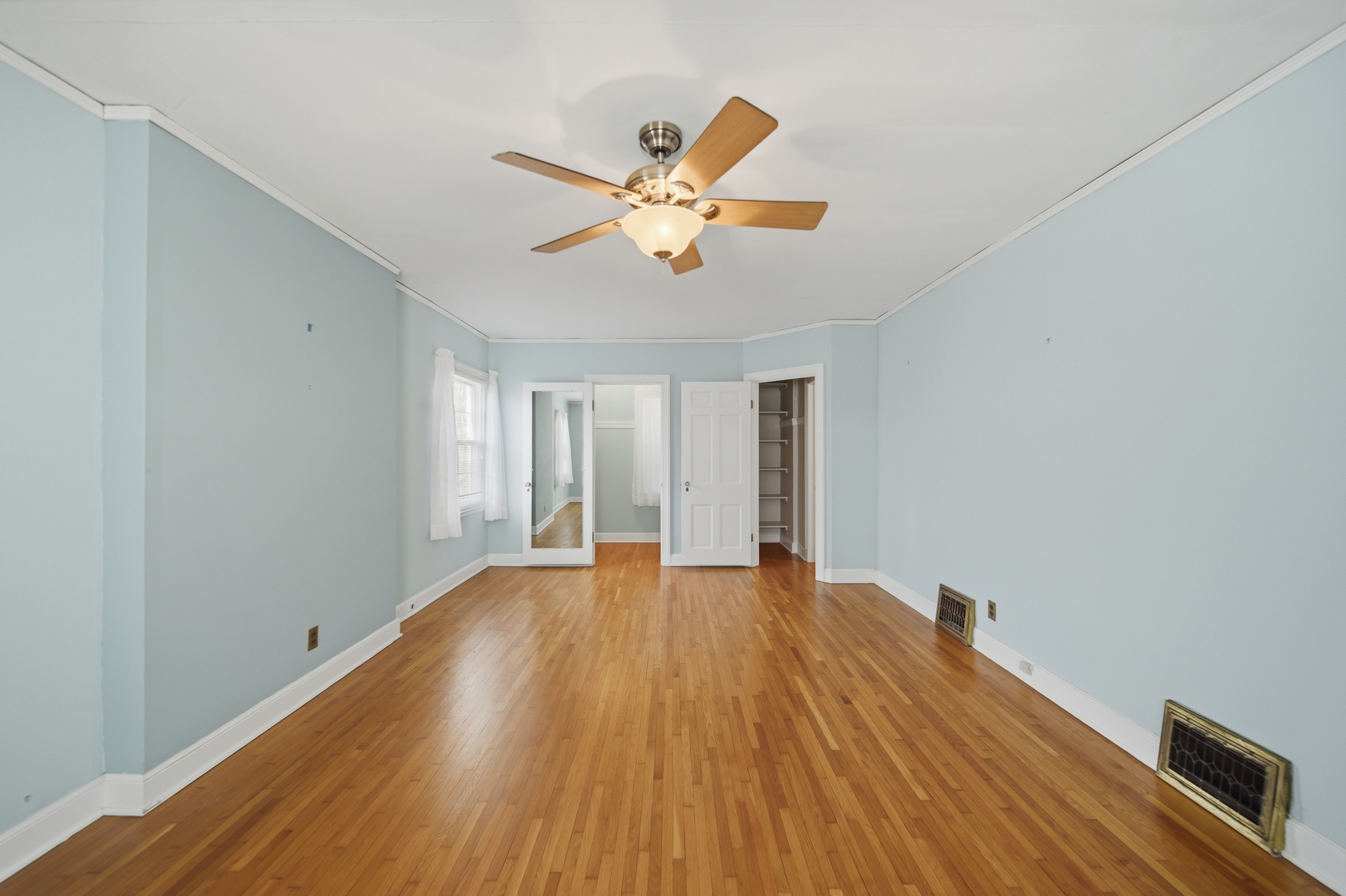 807 East Fellows Street Dixon, IL 61021 - Photo 25 of 31 a view of an empty room with window and wooden floor