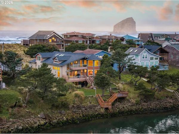 an aerial view of a house with a lake view