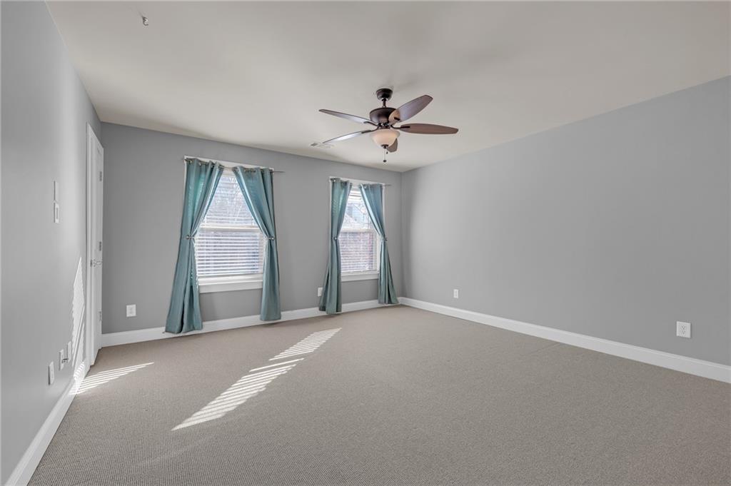 2048 Village Crest Drive Northwest Atlanta, GA 30318 - Photo 14 of 21 a view of a livingroom with a ceiling fan and window