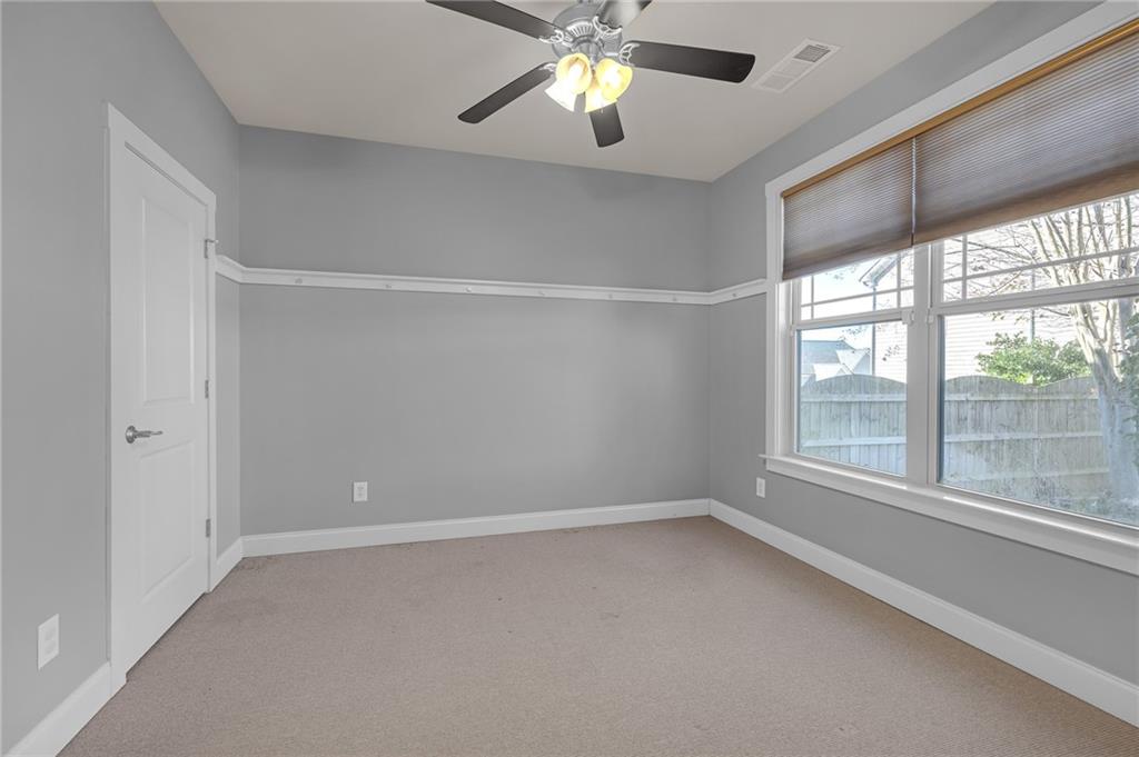 2048 Village Crest Drive Northwest Atlanta, GA 30318 - Photo 7 of 21 a view of an empty room with a window