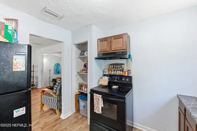 a living room with furniture and a tv