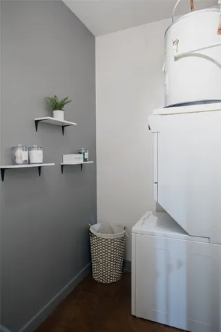 a room with a white cabinet and a blue wall