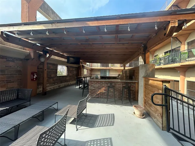 a view of balcony with furniture