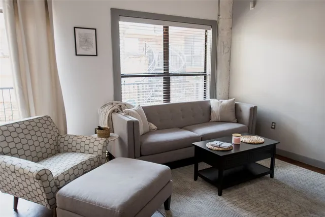 a living room with furniture and a window