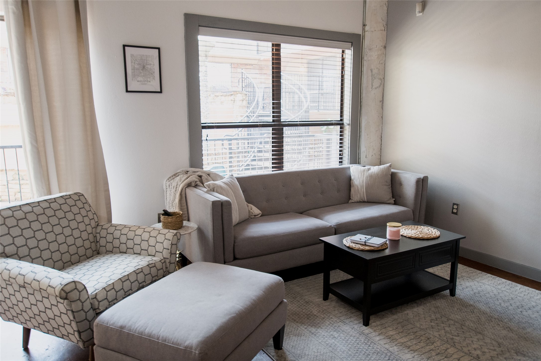 2205 McKinney Street, Unit 309 Houston, TX 77003 - Photo 3 of 14 a living room with furniture and a window