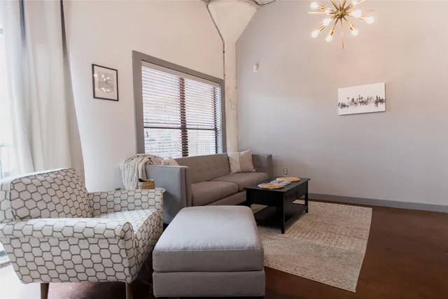 a living room with furniture and window