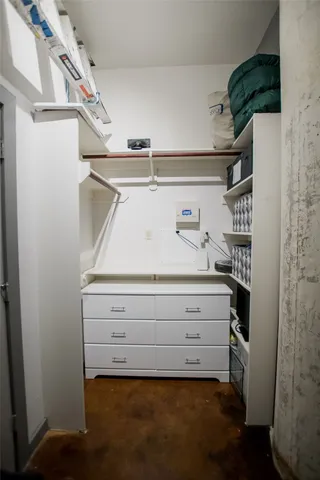 a view of storage and utility room with washer and dryer