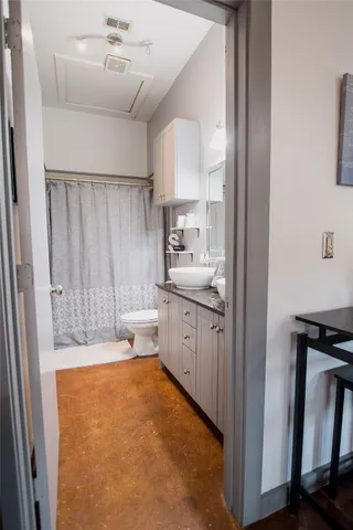 a large white kitchen with a sink