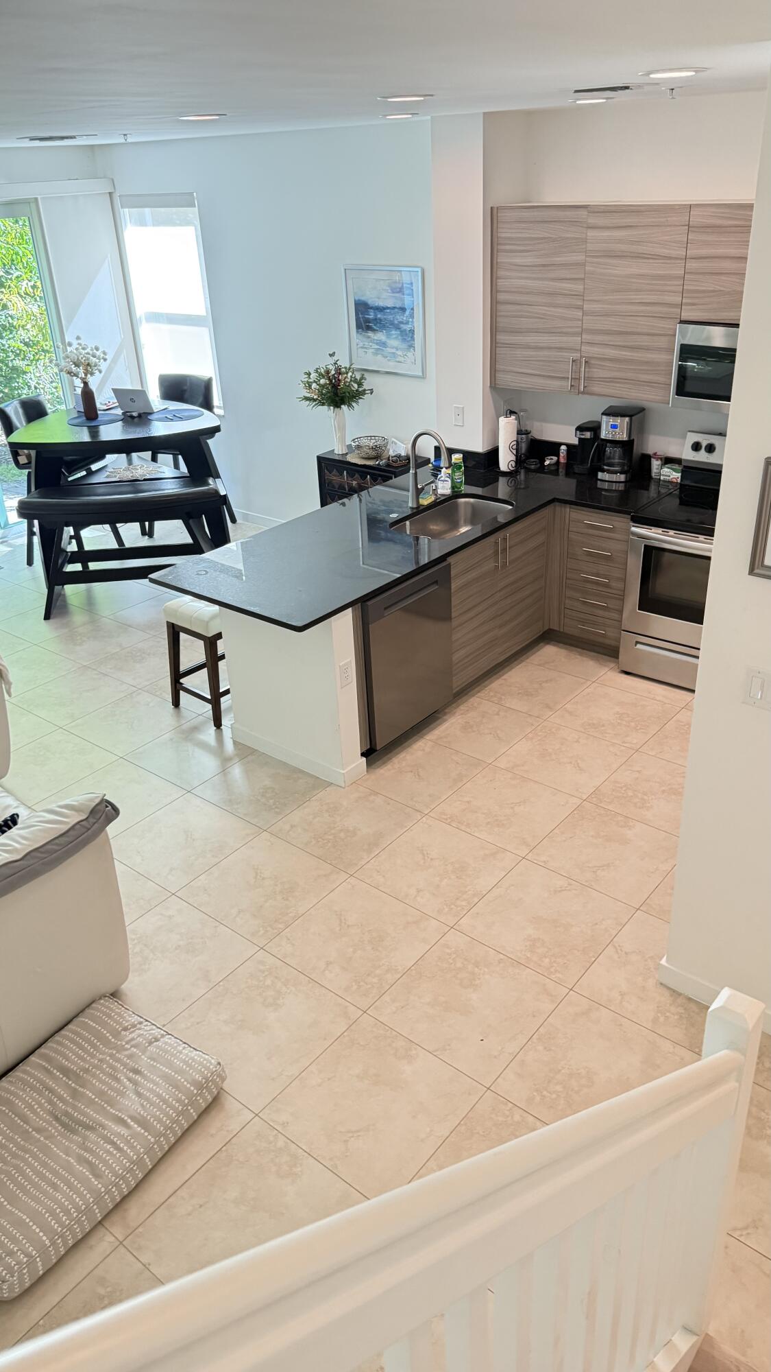 Undisclosed Address Hobe Sound, FL 33455 - Photo 12 of 20 a kitchen with stainless steel appliances kitchen island granite countertop a stove a sink and a granite counter tops