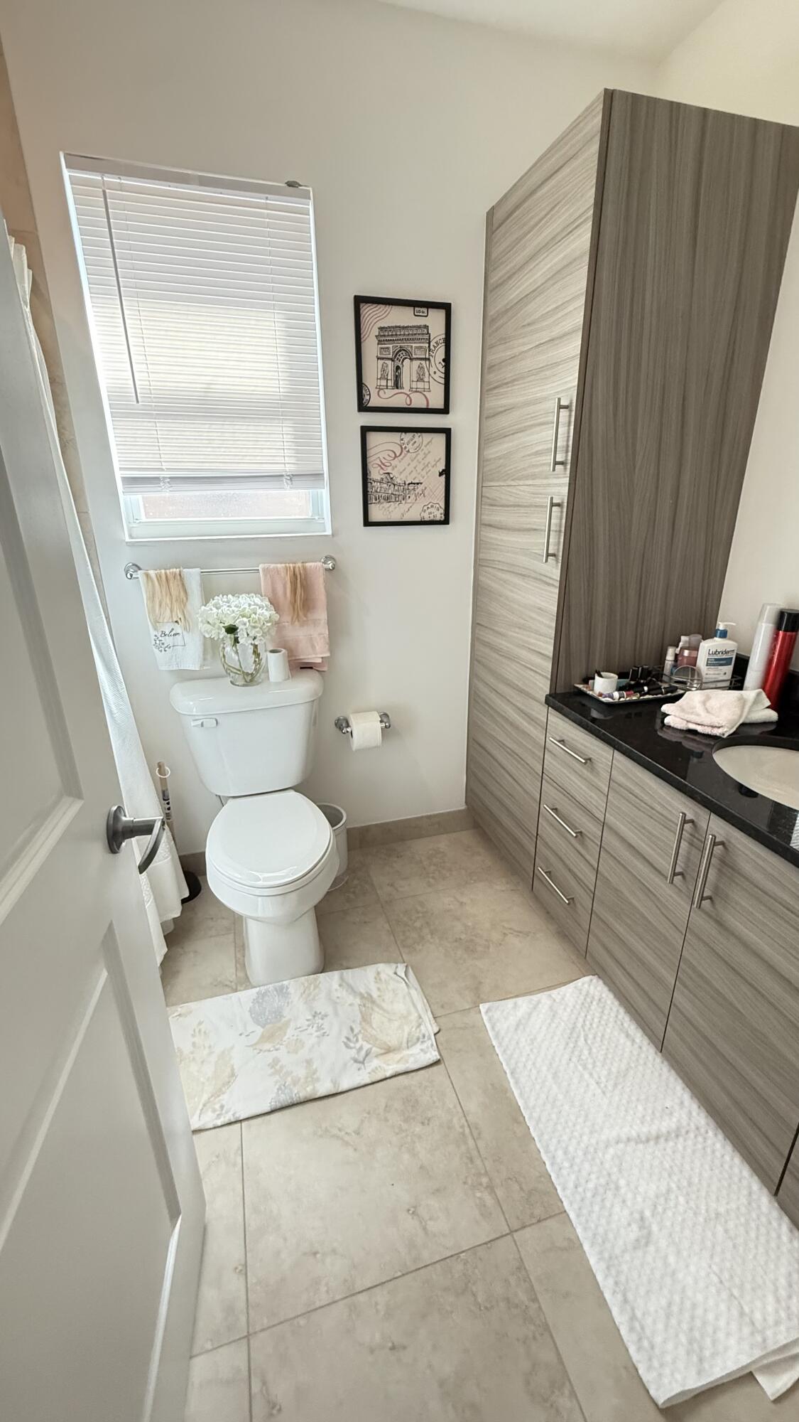 Undisclosed Address Hobe Sound, FL 33455 - Photo 13 of 20 a bathroom with a sink toilet and window