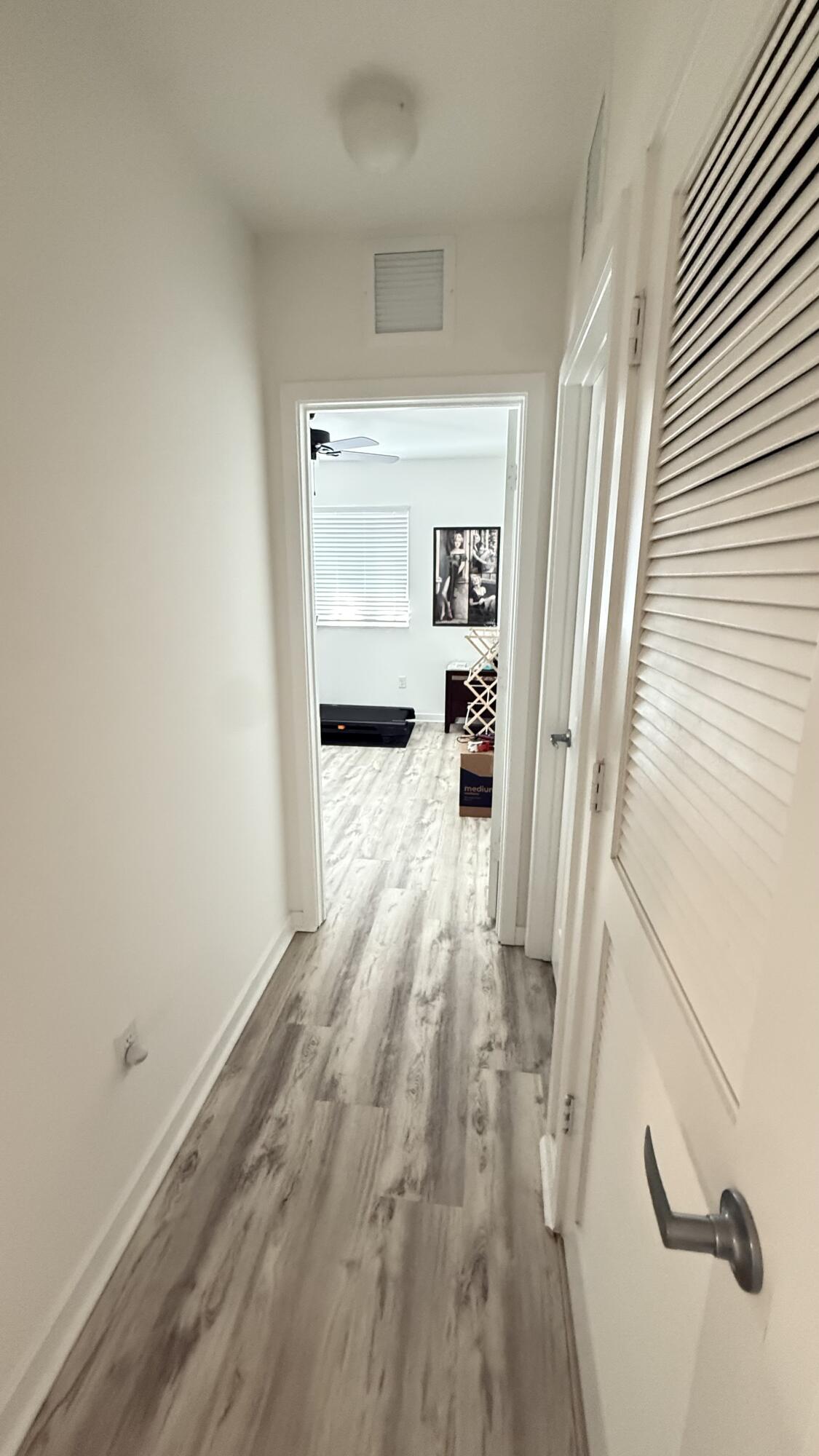Undisclosed Address Hobe Sound, FL 33455 - Photo 14 of 20 a view of a hallway view with wooden floor and staircase