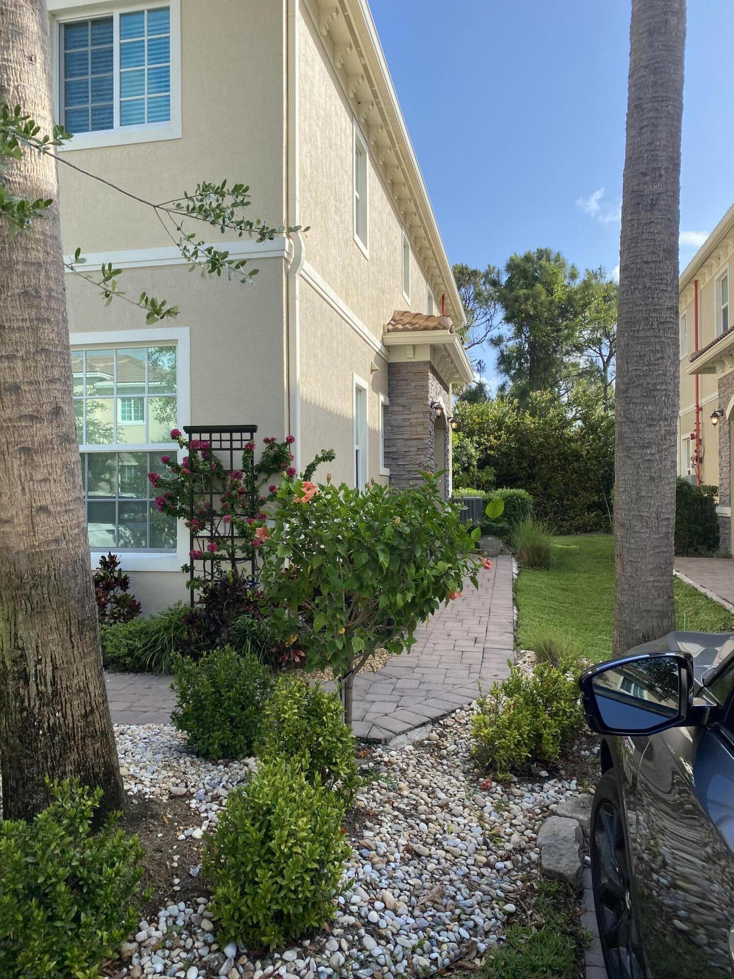 Undisclosed Address Hobe Sound, FL 33455 - Photo 2 of 20 a view of a house with backyard and garden