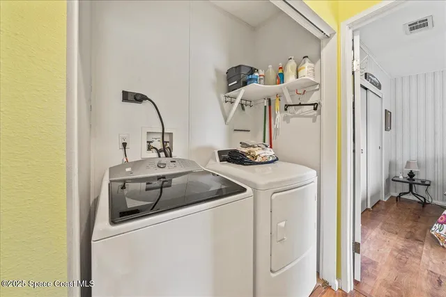 a kitchen with a sink and a refrigerator