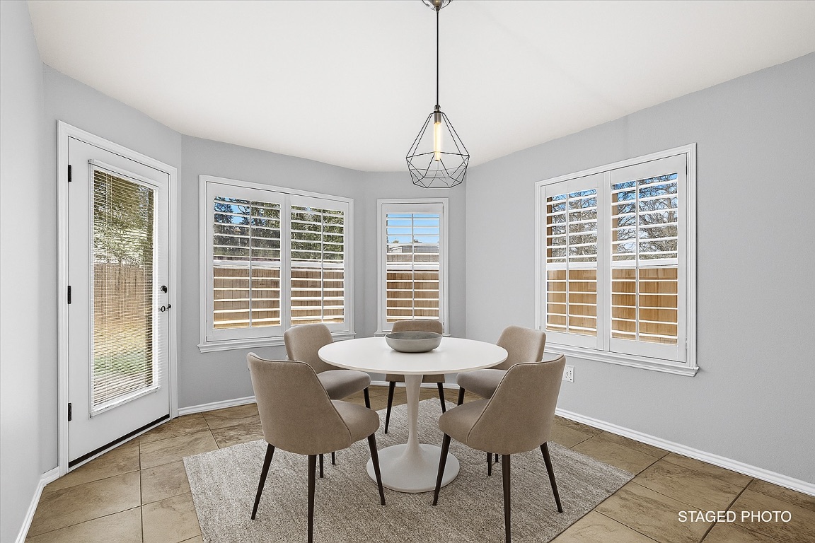 13438 Moscow Trail Austin, TX 78729 - Photo 2 of 40 Virtually Staged Dining area with tile patterned floors