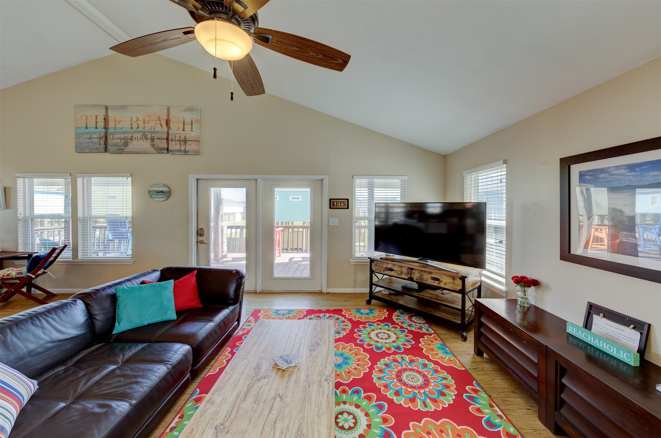 23005 Fresca Street Galveston, TX 77554 - Photo 12 of 37 a living room with furniture and a flat screen tv
