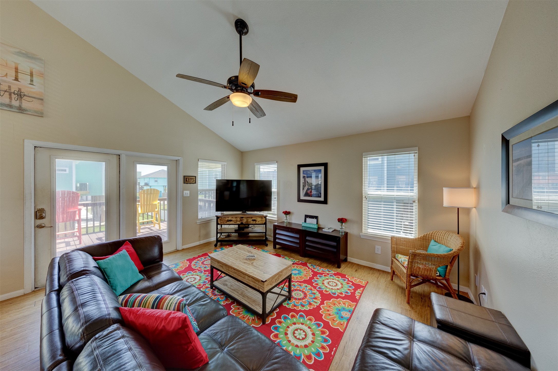 23005 Fresca Street Galveston, TX 77554 - Photo 13 of 37 a living room with furniture and a flat screen tv