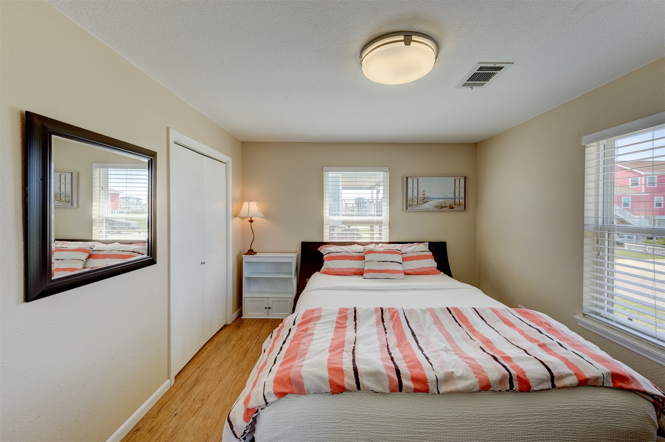 23005 Fresca Street Galveston, TX 77554 - Photo 19 of 37 a bedroom with a bed and a window
