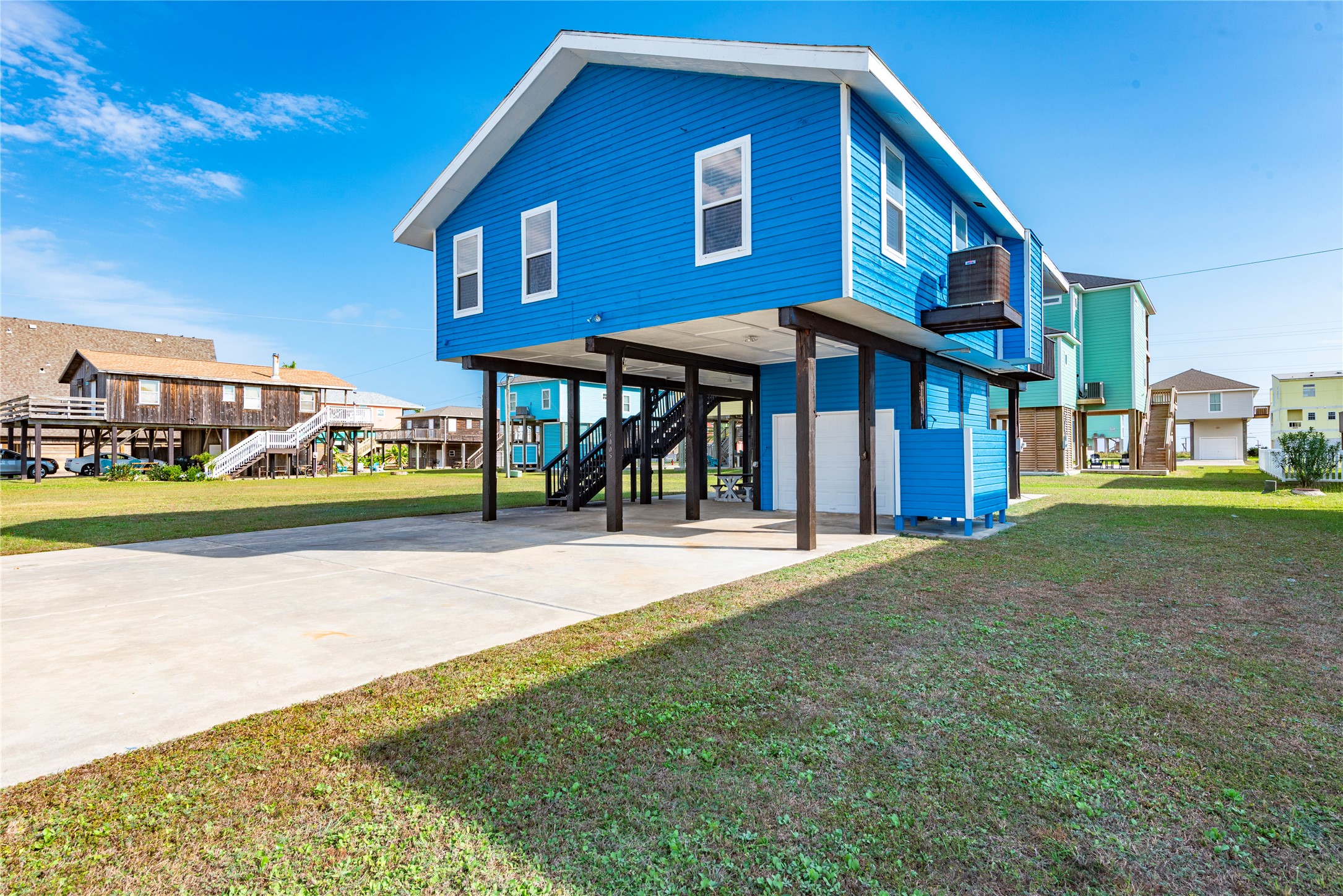 23005 Fresca Street Galveston, TX 77554 - Photo 2 of 37 a view of a house with a yard and sitting area