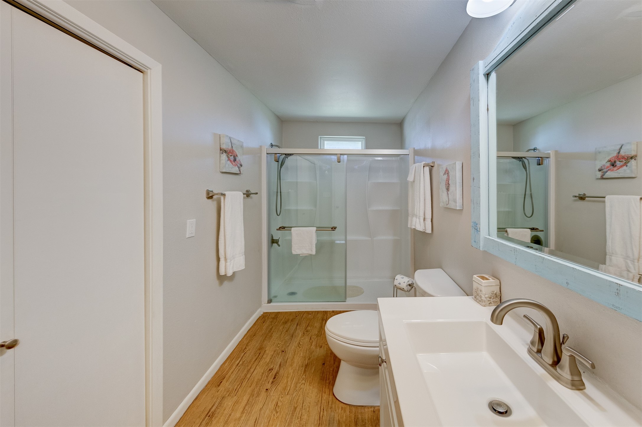 23005 Fresca Street Galveston, TX 77554 - Photo 21 of 37 a bathroom with a sink toilet and shower