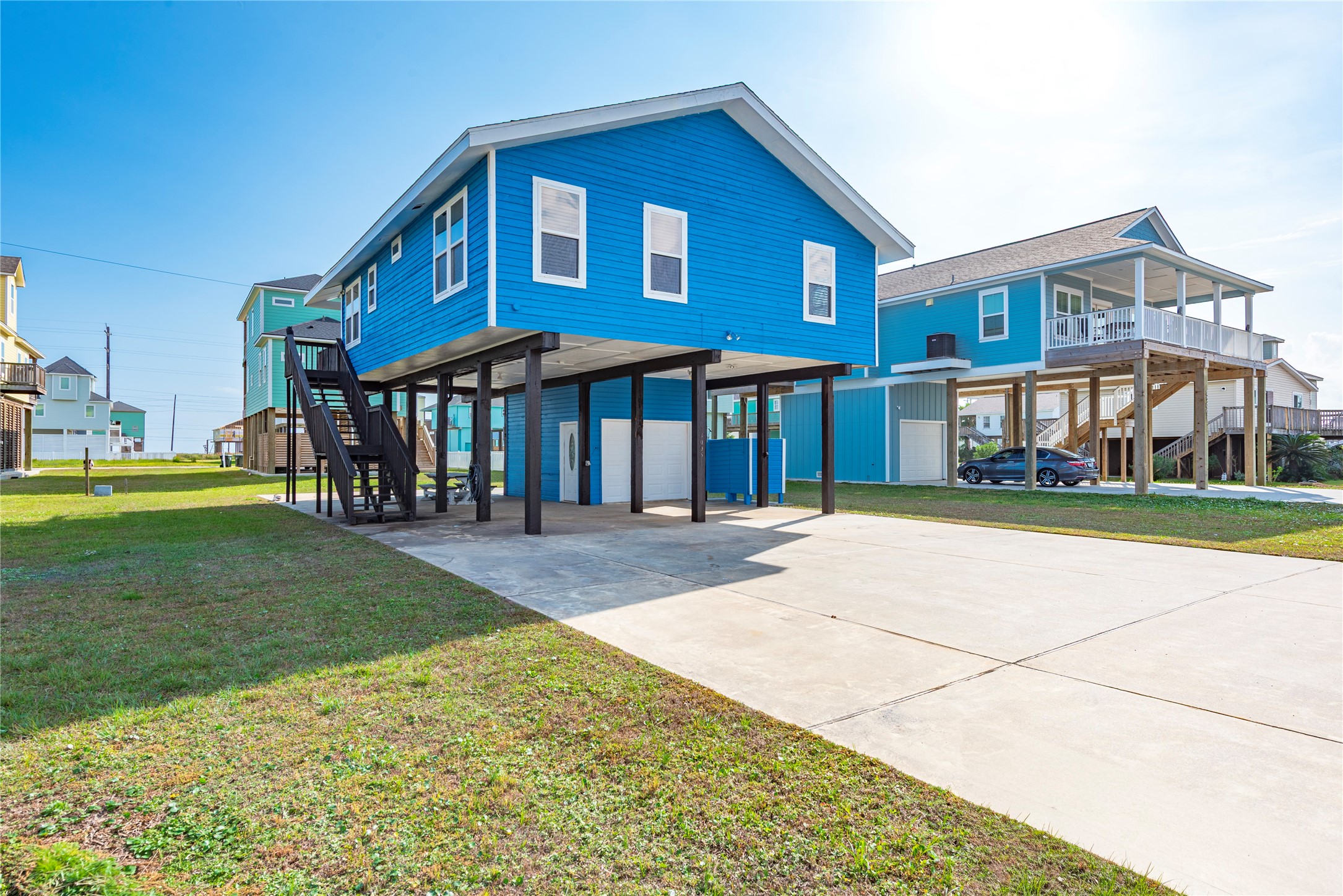 23005 Fresca Street Galveston, TX 77554 - Photo 25 of 37 a front view of a house with a yard