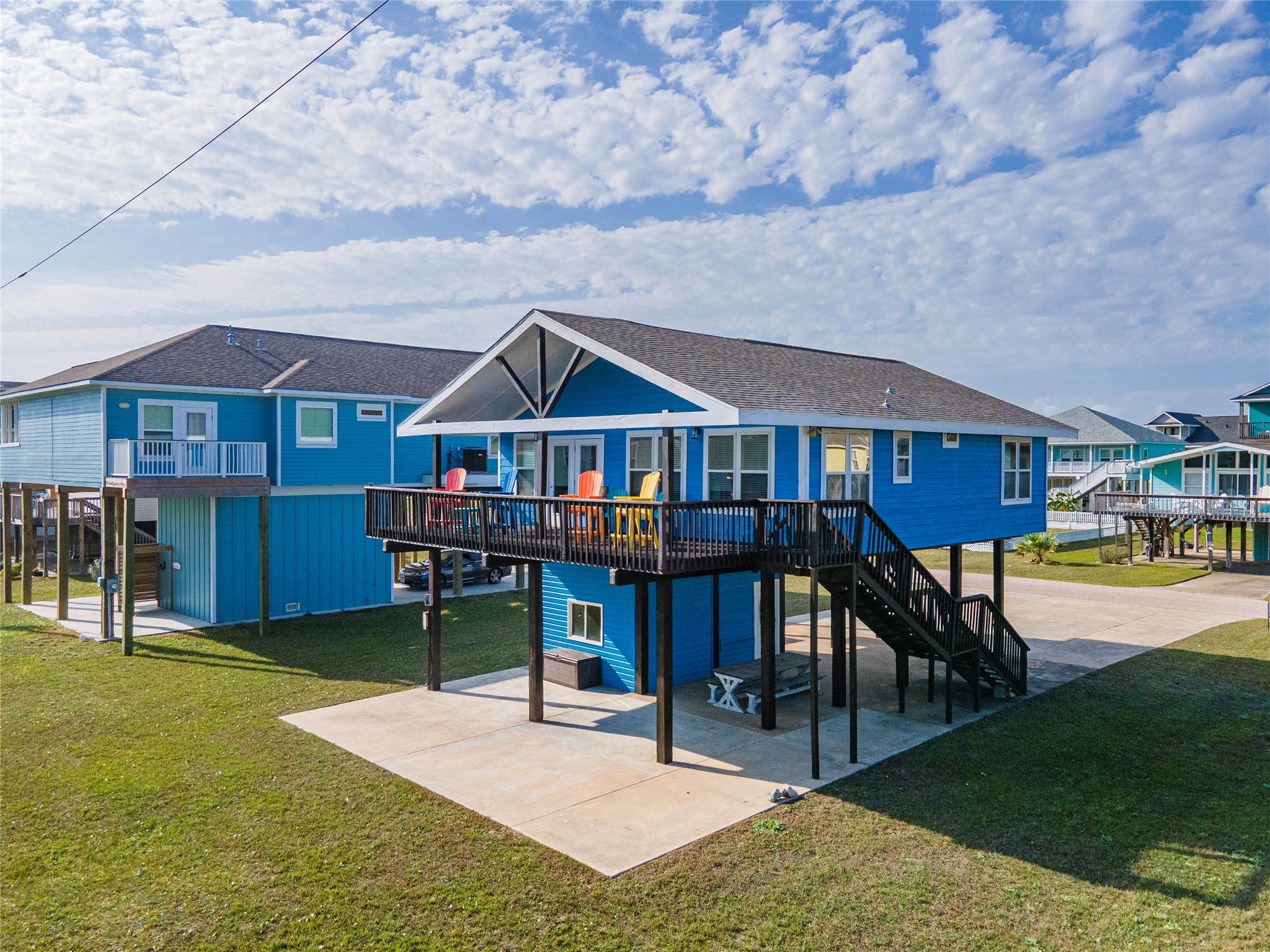23005 Fresca Street Galveston, TX 77554 - Photo 32 of 37 a view of a house with swimming pool and sitting area
