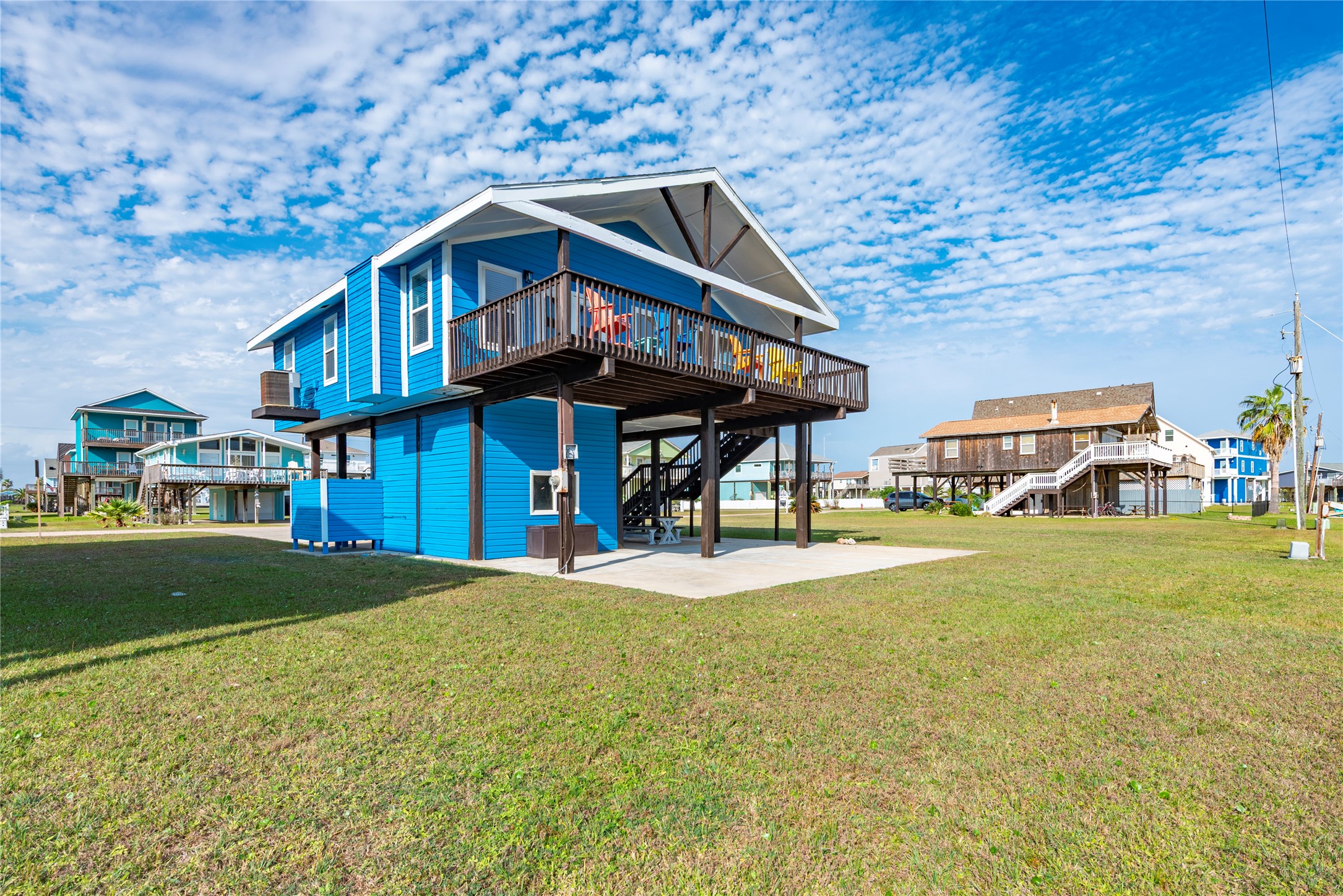 23005 Fresca Street Galveston, TX 77554 - Photo 5 of 37 a front view of a house with a yard