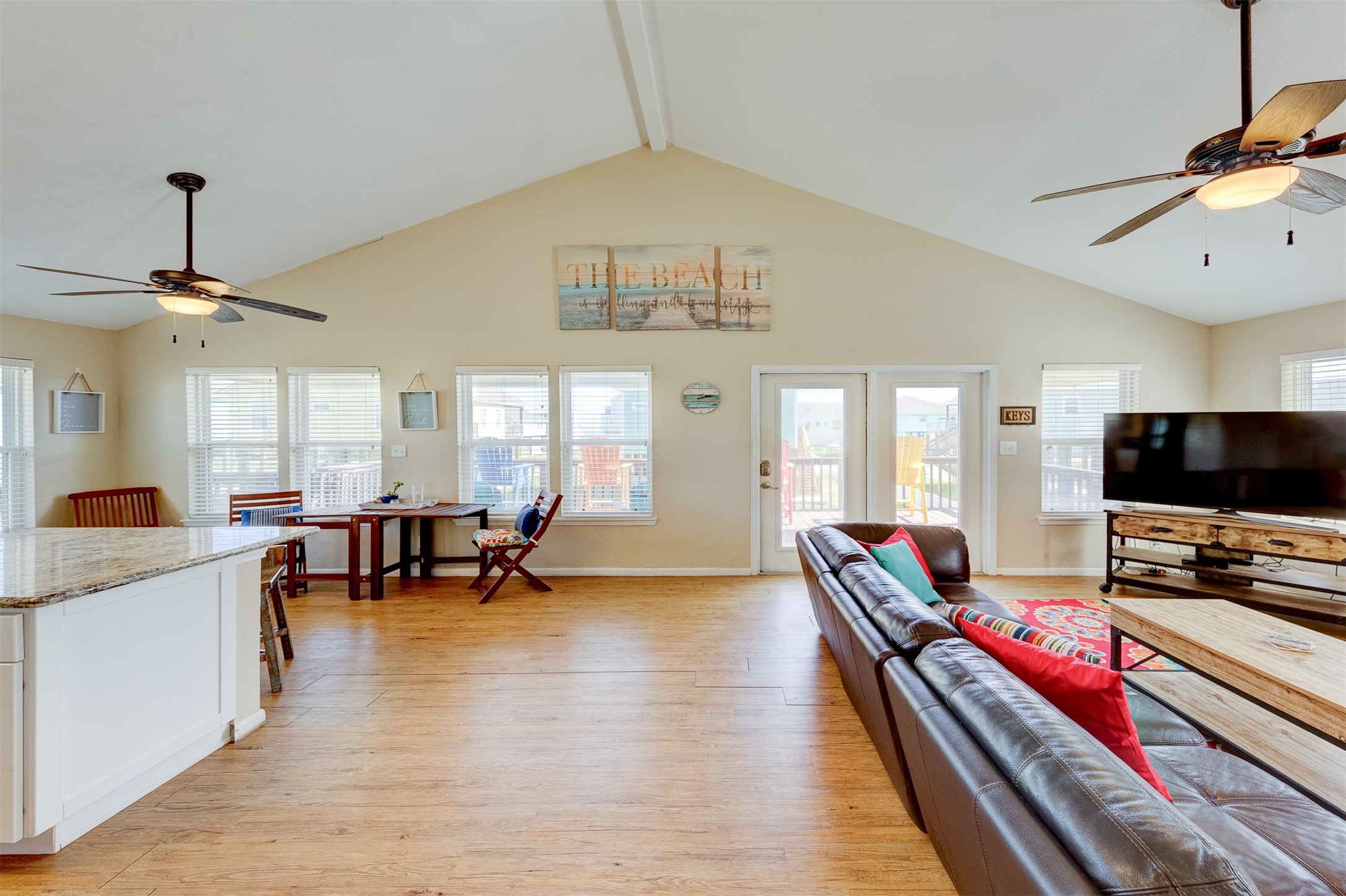 23005 Fresca Street Galveston, TX 77554 - Photo 6 of 37 a living room with furniture and flat screen tv
