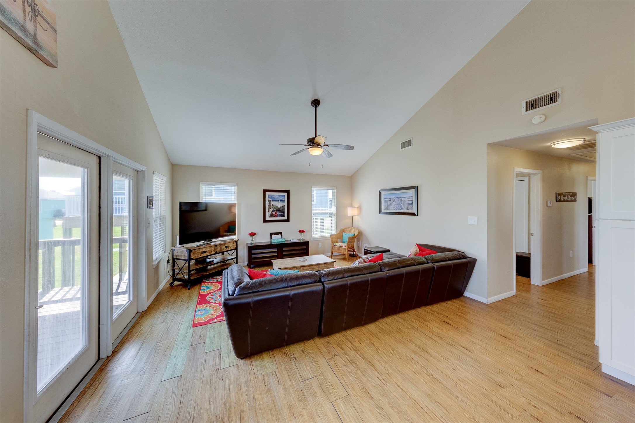 23005 Fresca Street Galveston, TX 77554 - Photo 8 of 37 a bedroom with a bed and a flat screen tv