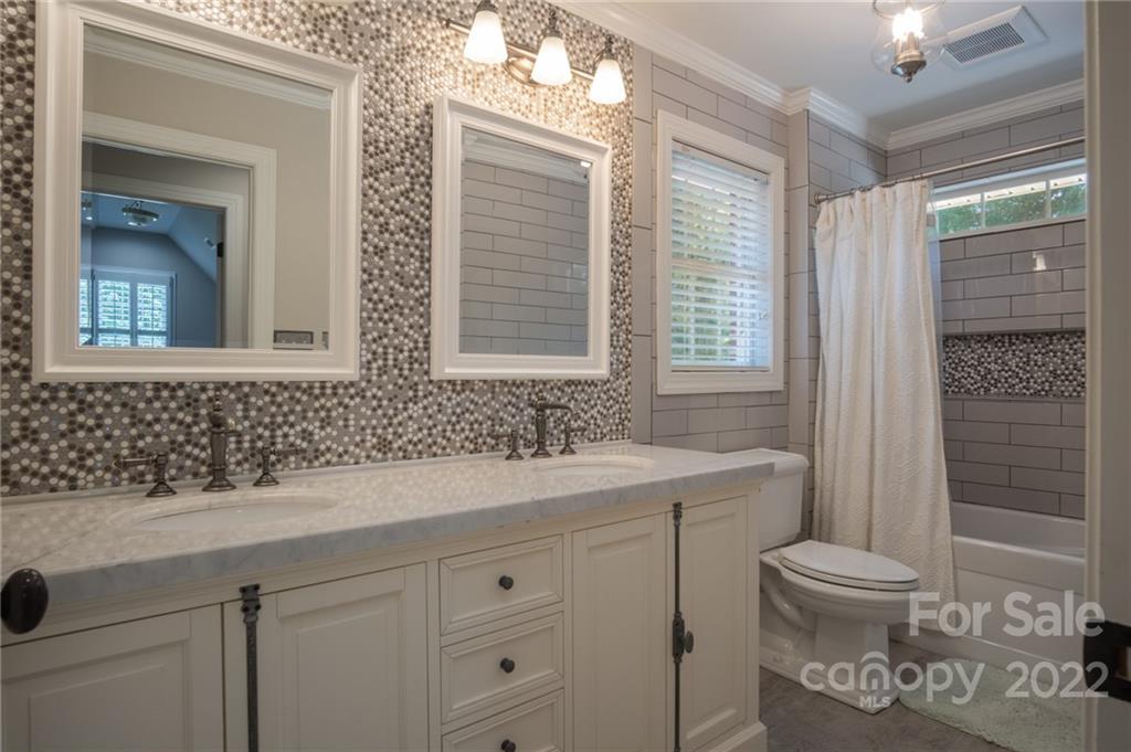 2900 Sliding Rock Trail Fort Mill, SC 29708 - Photo 21 of 41 a bathroom with a sink a toilet and shower