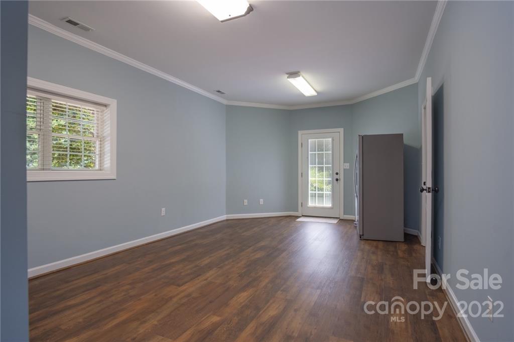 2900 Sliding Rock Trail Fort Mill, SC 29708 - Photo 27 of 41 a view of an empty room with wooden floor and a window