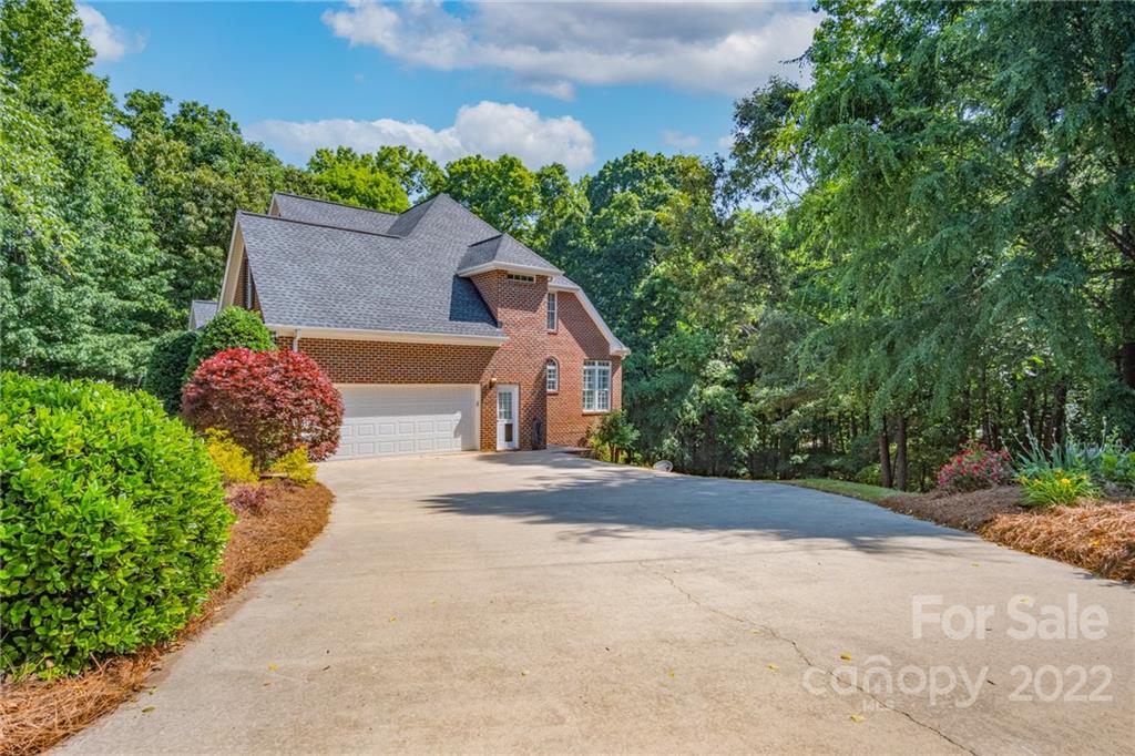 2900 Sliding Rock Trail Fort Mill, SC 29708 - Photo 3 of 41 a front view of a house with a yard and garage
