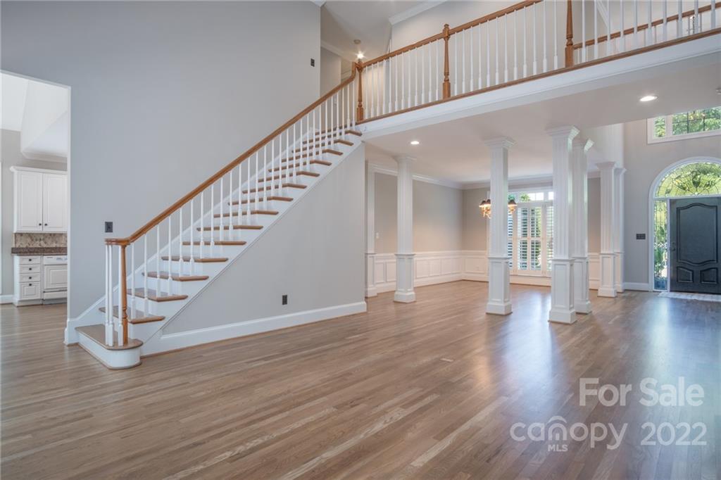 2900 Sliding Rock Trail Fort Mill, SC 29708 - Photo 9 of 41 a view of staircase with white walls and a chandelier