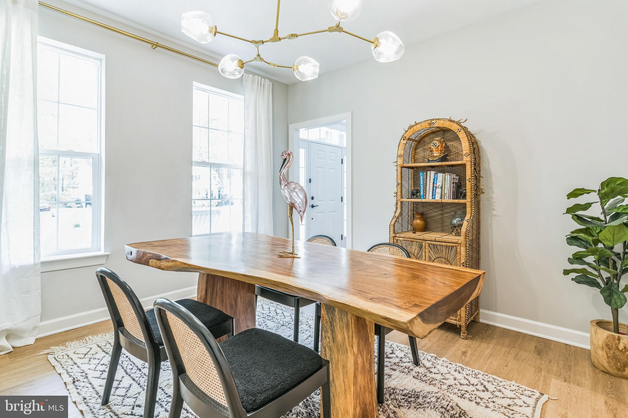 14720 Locust Court Issue, MD 20645 - Photo 14 of 41 a view of a dining room with furniture window and wooden floor