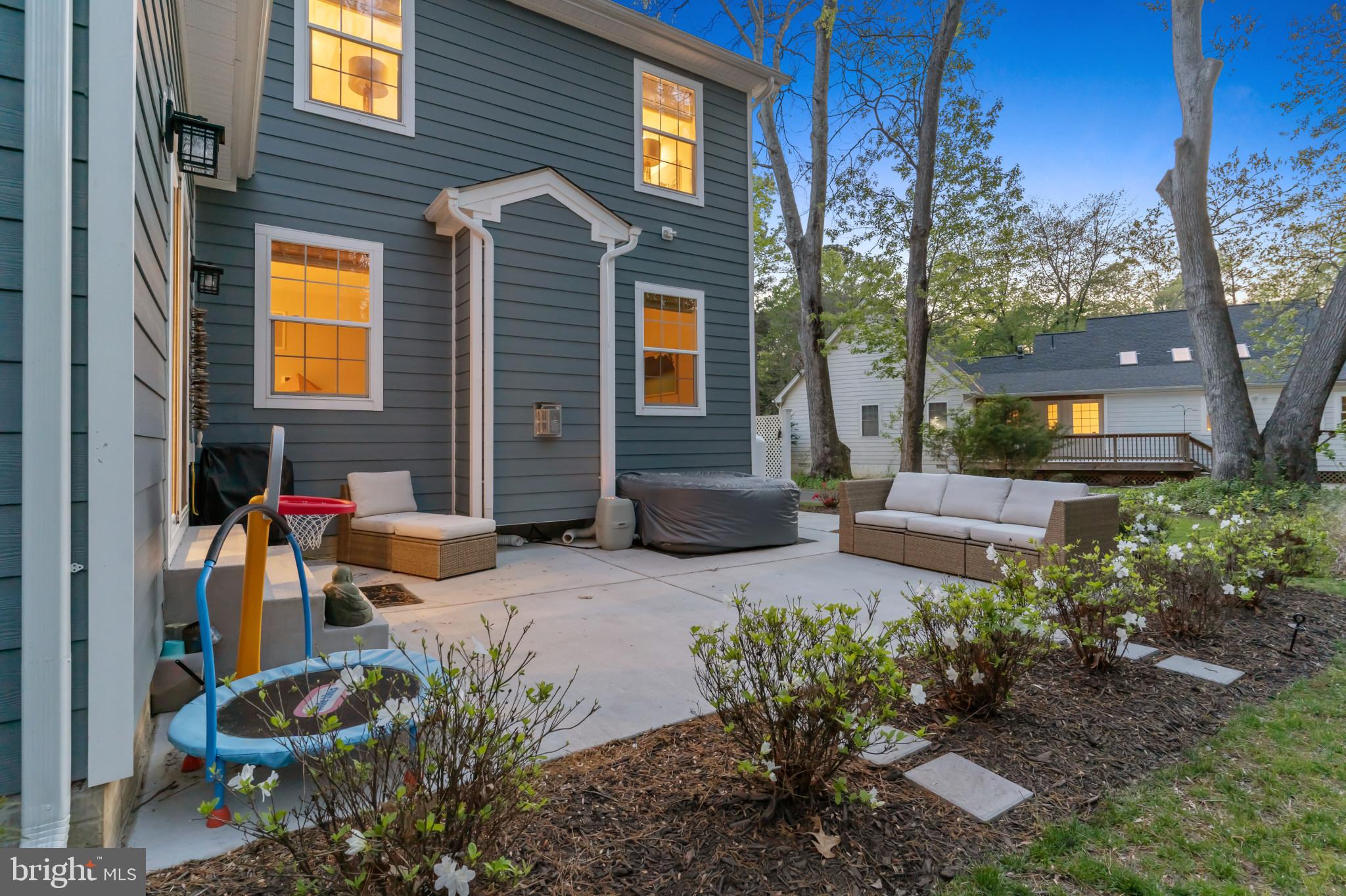 14720 Locust Court Issue, MD 20645 - Photo 30 of 41 a backyard of a house with outdoor seating