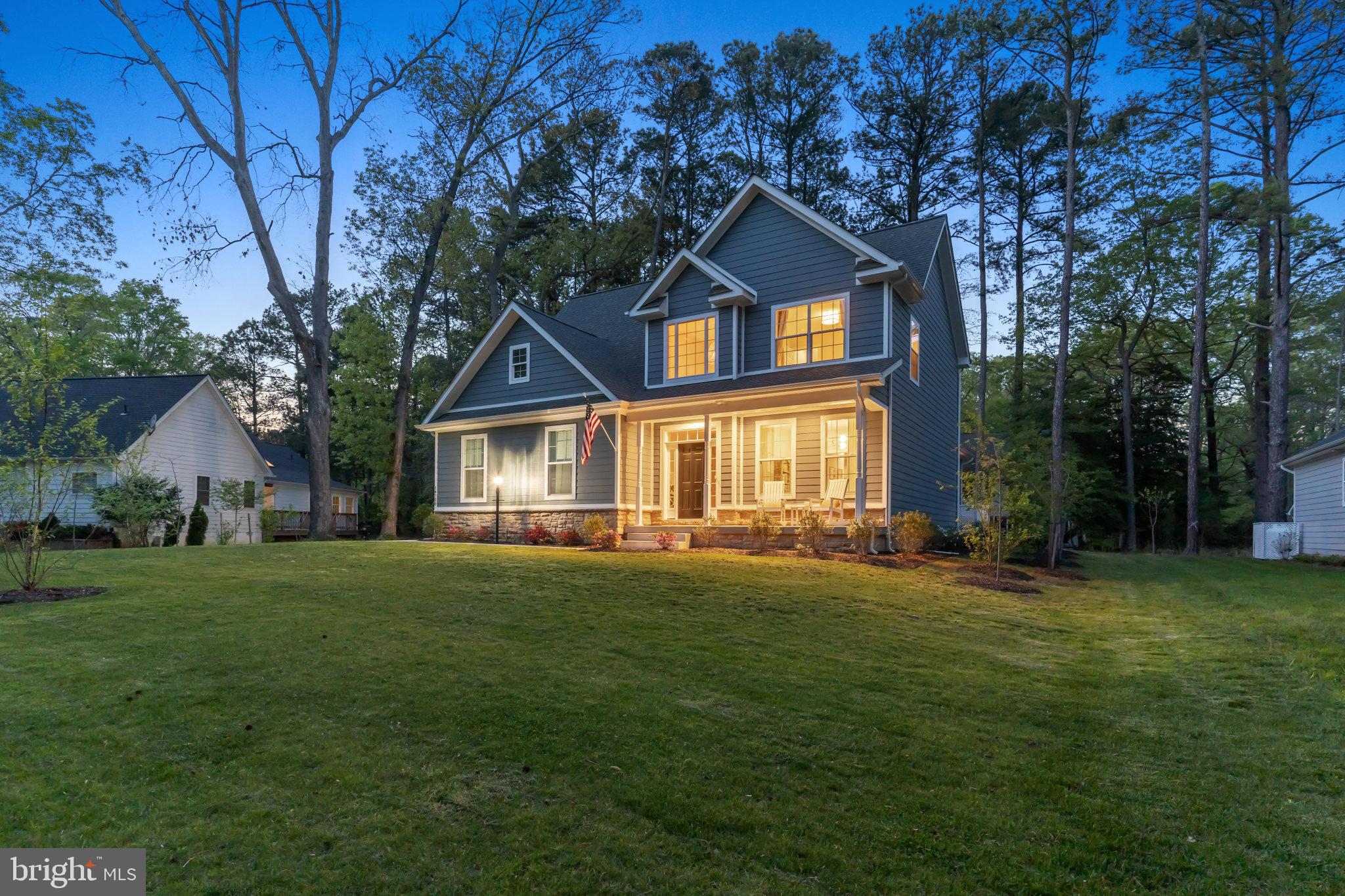 14720 Locust Court Issue, MD 20645 - Photo 37 of 41 a front view of a house with a yard