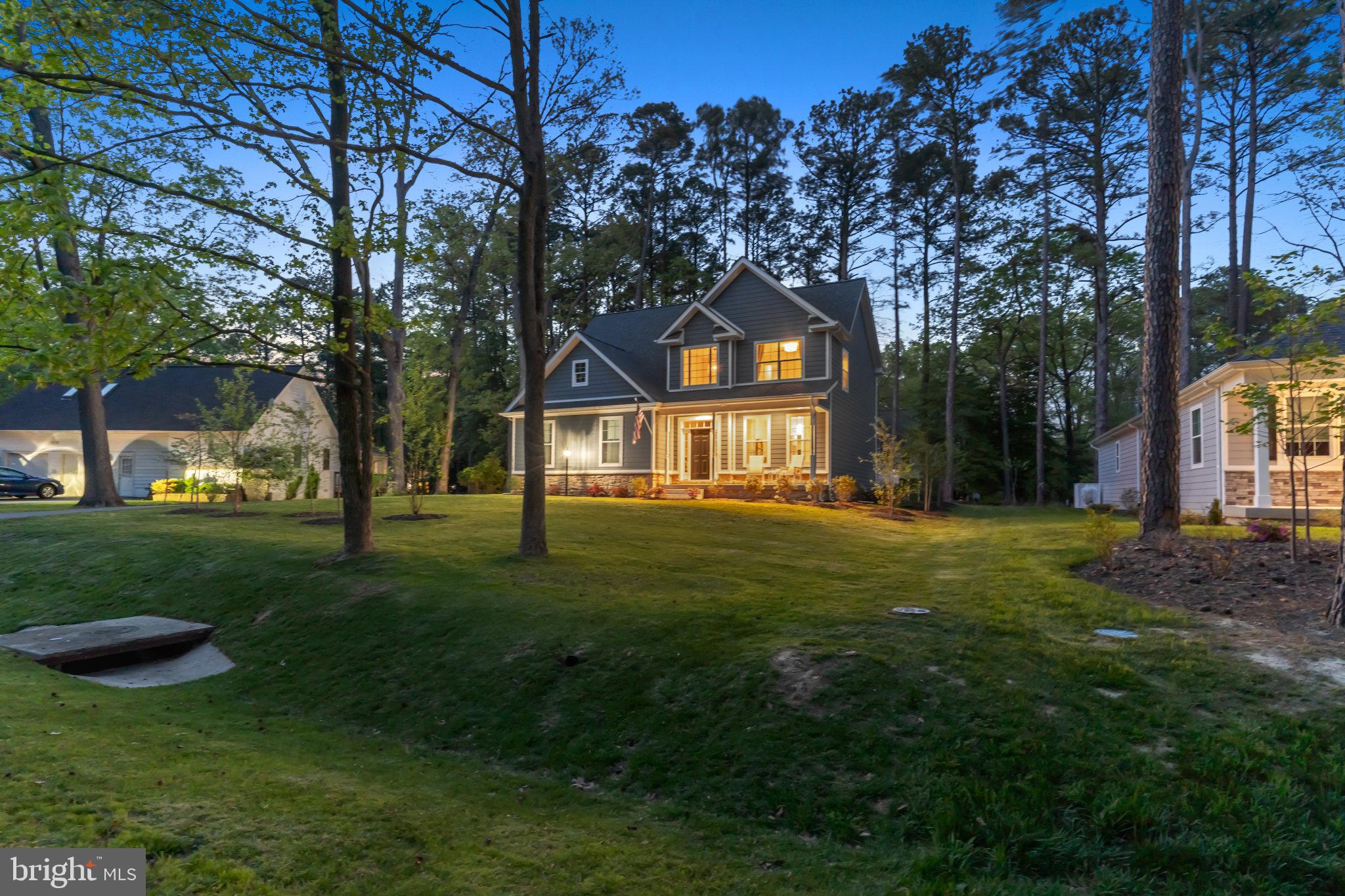 14720 Locust Court Issue, MD 20645 - Photo 38 of 41 a front view of a house with a garden