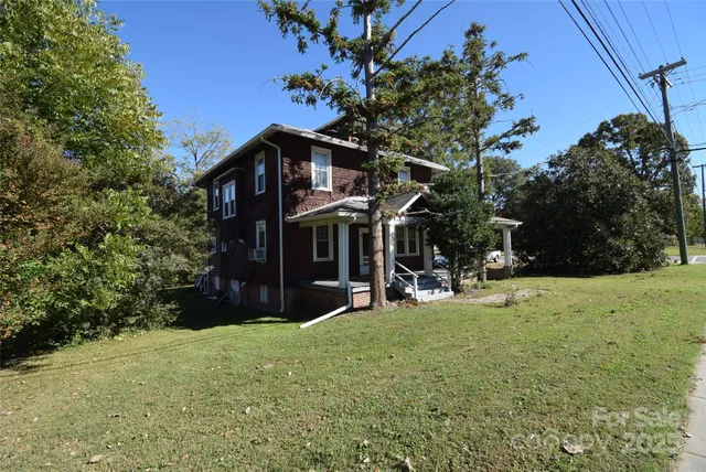 a view of a house with backyard porch and sitting area