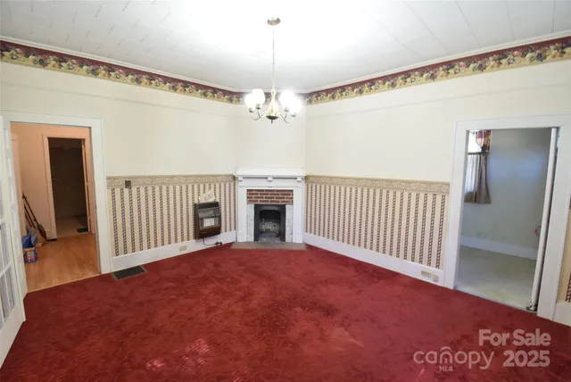 a view of empty room with windows