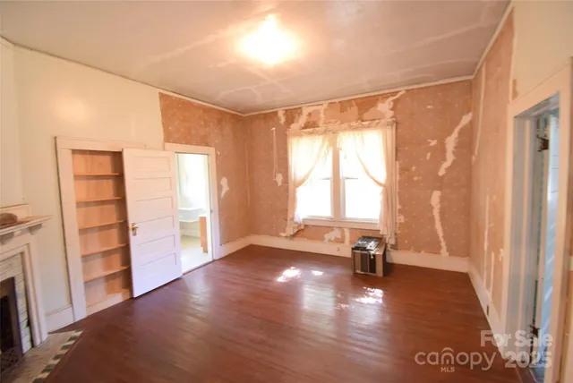 a view of an entryway with wooden floor and a window