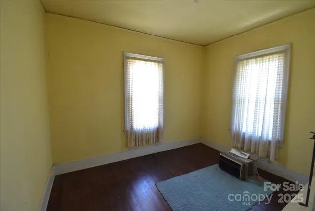 a room with window and furniture