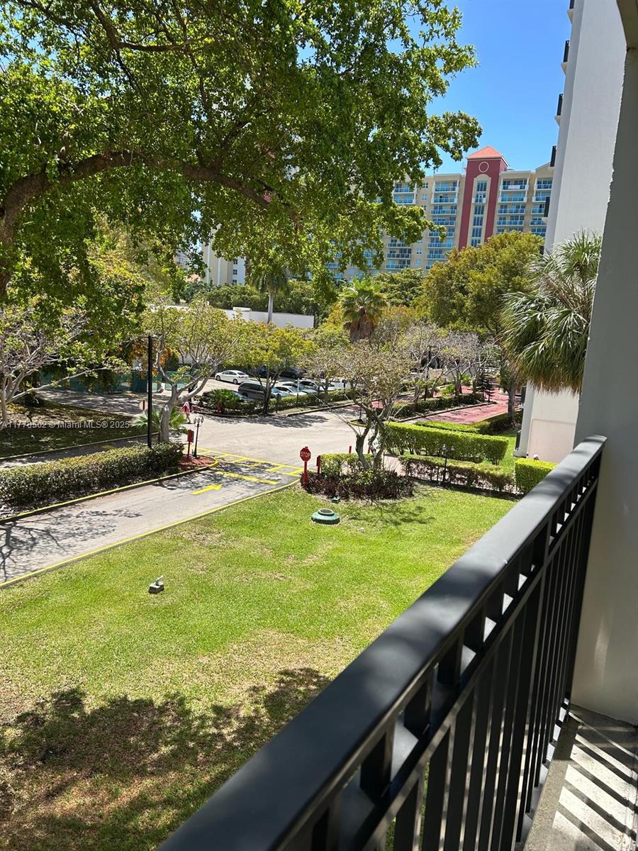 17021 North Bay Road, Unit 322 Sunny Isles Beach, FL 33160 - Photo 17 of 18 a view of a swimming pool with a garden
