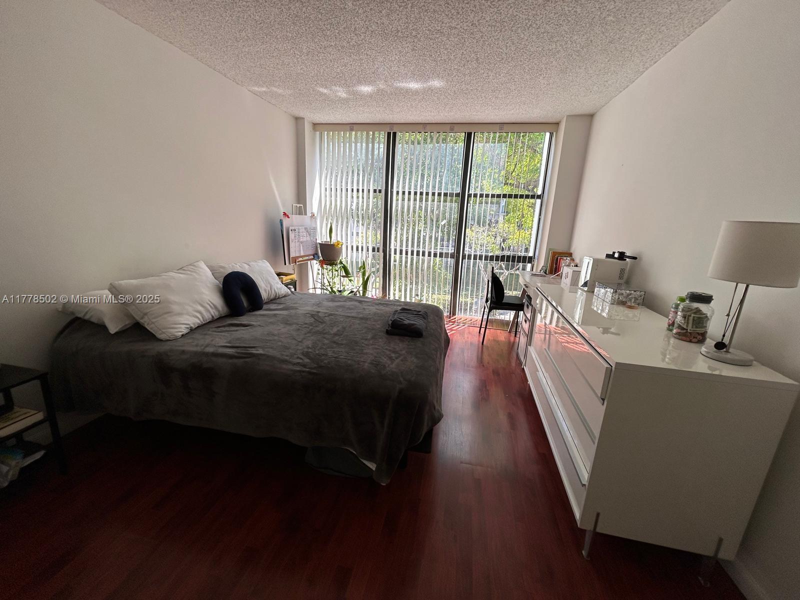17021 North Bay Road, Unit 322 Sunny Isles Beach, FL 33160 - Photo 9 of 18 a living room with furniture and a large window