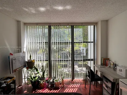 a view of a closet area with an empty room