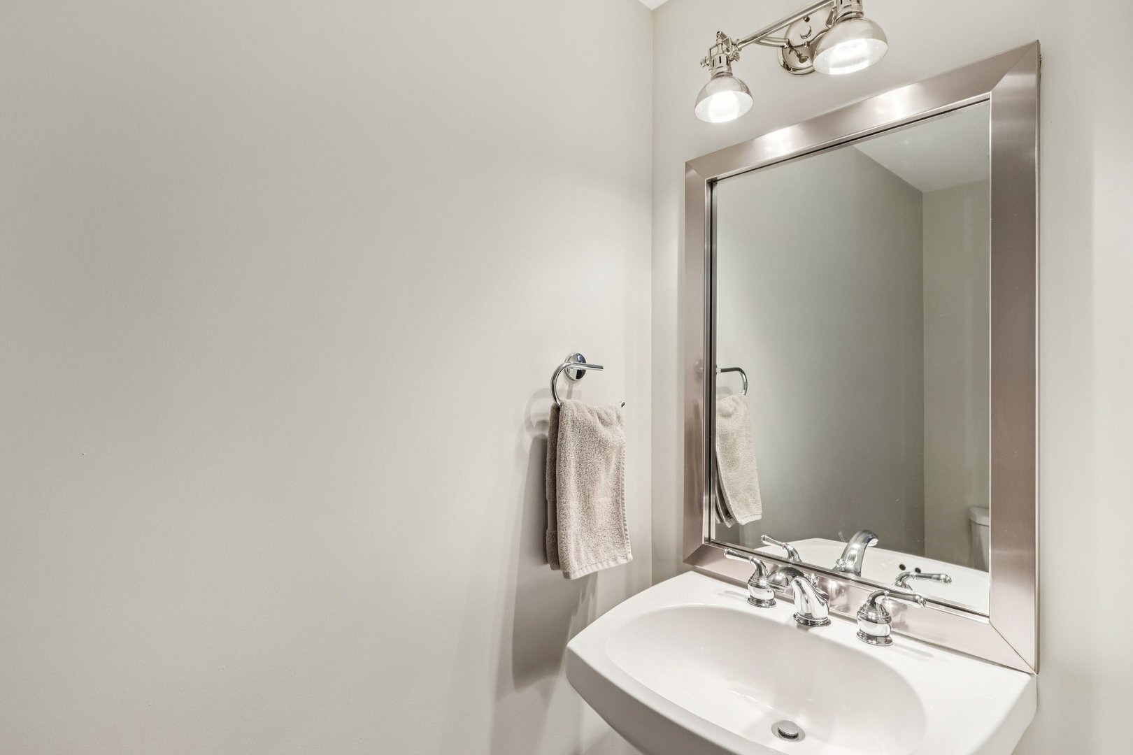 3137 North Spaulding Avenue Chicago, IL 60618 - Photo 11 of 42 a bathroom with a sink and a mirror