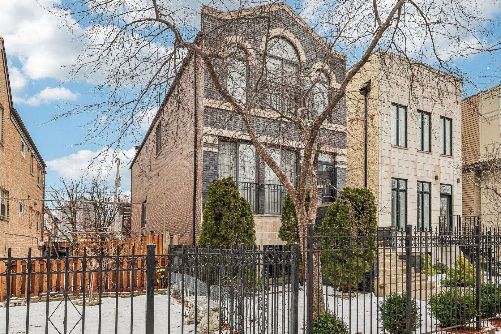 3137 North Spaulding Avenue Chicago, IL 60618 - Photo 3 of 42 a view of a house with a small yard and wooden fence